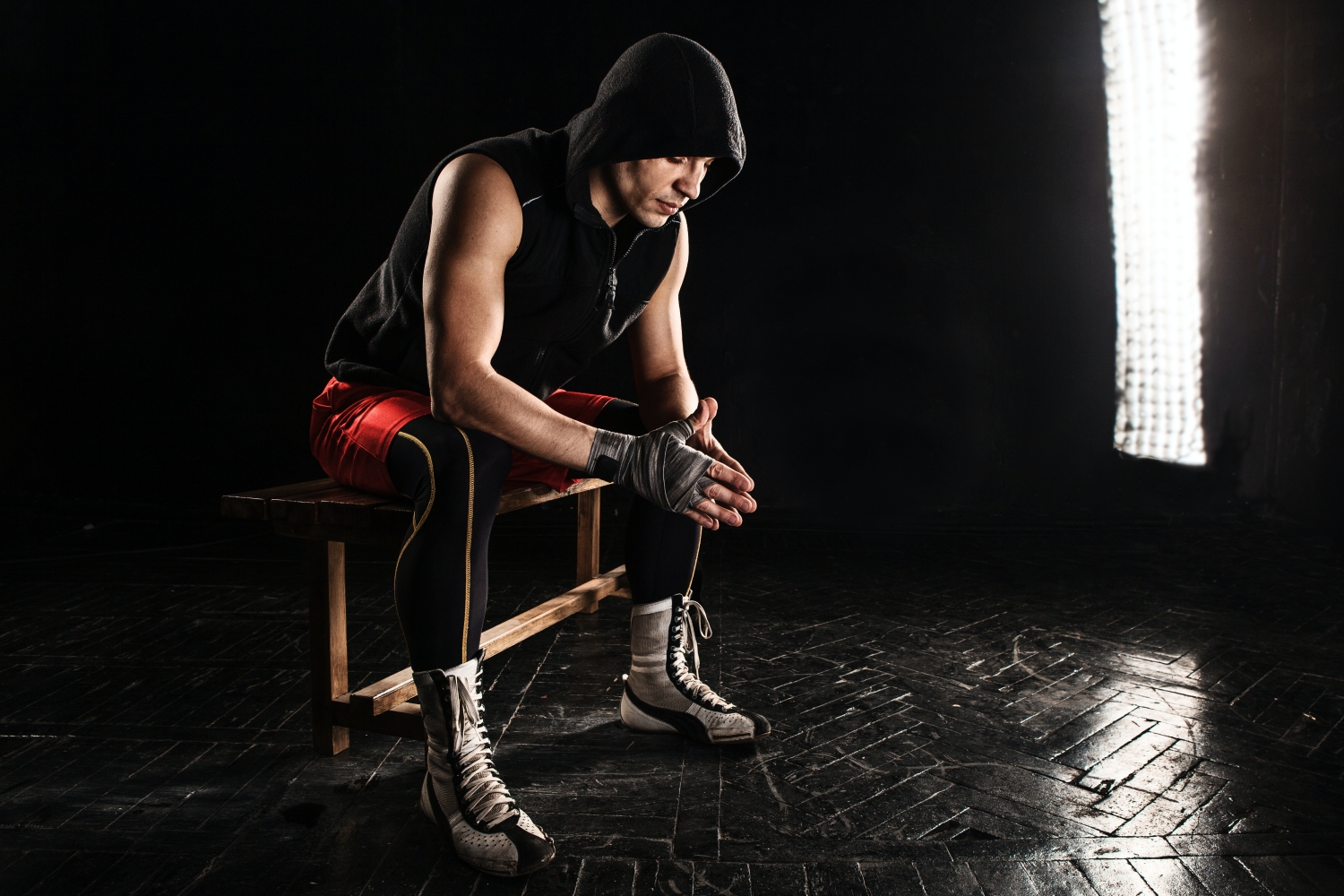 muscular-boxer-sitting-resting-black